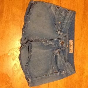 Light blue denim shorts.